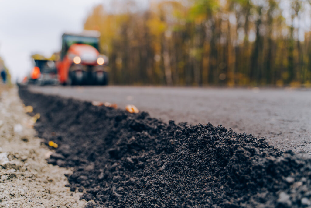 Close view on the new road construction site. Close up asphalt at the road under construction. Asphalting
